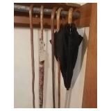 4 canes and an umbrella