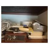 2 shelves. Rope,  books, 2 boat radios