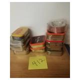 Metal tins with hooks, screws etc.