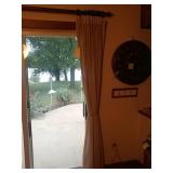 Cream colored curtains with wood rod (in dining