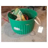 Green bucket with tools and quickrete