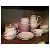 Tea set:   tea pot  and cups and saucers