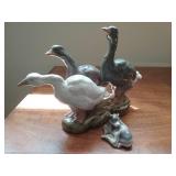 Three ducks figurines  and cow