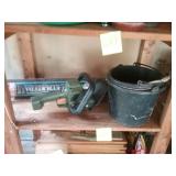 Two buckets and trimmer weed mat