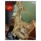 Two gold shiny light up reindeers