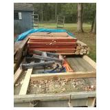 Scrap wood with 2 small saw horses. 30 sheets of