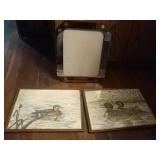 2 duck drawings and a mirrored frame