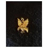 Gold eagle pendant
