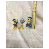 Three Donald duck toys