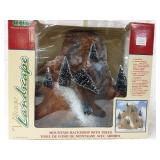 Lemax village landscape. Mountain backdrop with