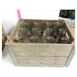 1 milk crates and 12 milk bottles