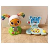 Vtech bears baby laptop and Fisher Price dog.