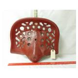 Red cast iron tractor seat. 15x17
