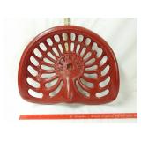 Deering red cast iron tractor seat. 18x17