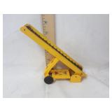 Yellow metal elevator toy