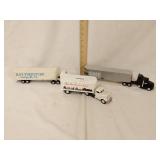 3 truck and trailers