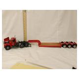 Mack truck and trailer. Passenger mud flap broke.