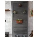 Handcrafted louvered door art with 6 metal pots