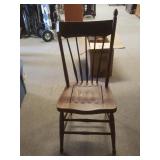 Older wooden chair with wooden seat