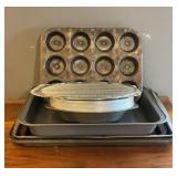 Box full of metal cooking pans. 14