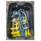 Tote full of garden sprinklers.