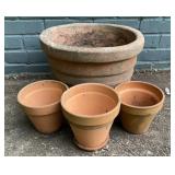 4 outdoor flower pots. Larger one is 14.5 wide