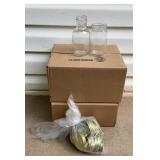 24 8 ounce glass jars and a bag of lids.