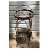 Antique wrought iron plant stand. With a handle