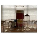 Coleman 1/2 gallon water jug, glass kitchen jars.