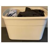 Clothes in tote, pants, tops