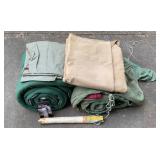Camping lot two green sleeping bags, fire starter