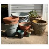 13 Plastic outdoor pots, plus a plastic tote.