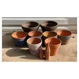 8 outdoor flower pots, one has a crack plus 2
