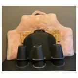 Large pink pillow, bed risers, black cushion
