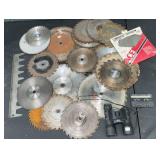 Various saw blades, Tasco binoculars, cassette