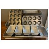 Metal kitchen baking pans. 10 bread pans, 2 made