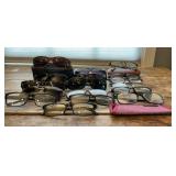 7 Pairs of sunglasses, 10 glasses. 3 cases