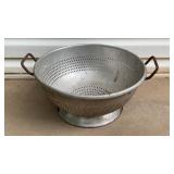 Vintage commercial-grade aluminum colander. 17in