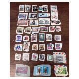 Large lot of VTG stamps still on envelope paper