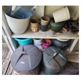 Shelves Full Of Flower Pots & Trash Cans