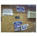 Ford Signs & Old :icense Plates on Wall