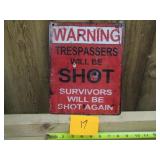 Red Warning Trespassers Will Be Shot Sign