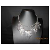 Silver tone necklace with leaves