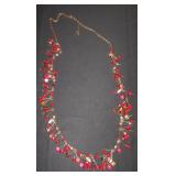 gold tone chain with little bunches of beads