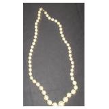 white pearl like bead necklace