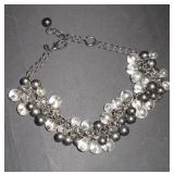 necklace with black and clear balls on it