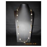 Silver tone necklace with encrusted beads.
