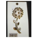 silver flower with black gems