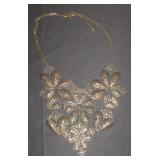 Bronzed tone necklace with filigree floweres