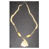 Yellow round beads with yellow stone pendent